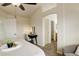 Cozy main bedroom with neutral tones, a ceiling fan and a convenient vanity space at 8510 Bluegrass Cir, Parker, CO 80134