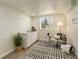 Flex space featuring a double sink vanity, area rug, and natural light at 8510 Bluegrass Cir, Parker, CO 80134