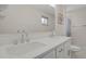 Bright bathroom features dual sinks with modern faucets and a large mirror at 3175 Zinnia Ct, Golden, CO 80401