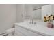 Clean bathroom featuring white cabinets, a quartz countertop, and a modern faucet at 3175 Zinnia Ct, Golden, CO 80401