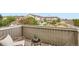 Cozy balcony overlooking neighborhood with chairs and table with plants at 14700 E 104Th Ave # 2802, Commerce City, CO 80022