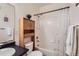 Bathroom with a shower and tub combination and built-in storage at 14700 E 104Th Ave # 2802, Commerce City, CO 80022