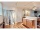 Bright kitchen features hardwood floor, white wall paint and recessed lighting at 14700 E 104Th Ave # 2802, Commerce City, CO 80022