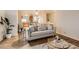 Stylish living room featuring hardwood floors, a comfortable sofa, and neutral decor at 14700 E 104Th Ave # 2802, Commerce City, CO 80022