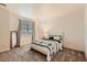 Calm main bedroom with soft carpet, natural light, and elegant black and white accents at 14700 E 104Th Ave # 2802, Commerce City, CO 80022