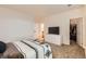 Spacious main bedroom featuring carpeted floors, a dresser, and closet access at 14700 E 104Th Ave # 2802, Commerce City, CO 80022