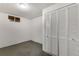 Unfinished basement room with built-in storage at 3995 Independence Ct, Wheat Ridge, CO 80033