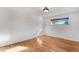 Well-lit bedroom featuring hardwood floors and a window at 3995 Independence Ct, Wheat Ridge, CO 80033