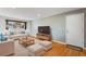 Bright living room featuring hardwood floors and comfy seating at 3995 Independence Ct, Wheat Ridge, CO 80033