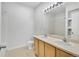 Bright bathroom with a double vanity and large mirrors, offering a spa-like experience in a modern setting at 5255 Memphis St # 317, Denver, CO 80239