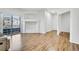 Living room with a balcony and large windows, light floors, and a built-in shelf feature at 5255 Memphis St # 317, Denver, CO 80239