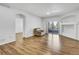 Spacious living area featuring beautiful wood floors, neutral walls, and natural light at 5255 Memphis St # 317, Denver, CO 80239