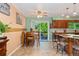 Inviting dining area with sliding glass doors to a deck and kitchen at 5870 Quail St, Arvada, CO 80004