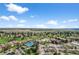 Wide angle community aerial view, featuring landscaped grounds, tennis courts, golf course, and parking at 13850 E Marina Dr # 304, Aurora, CO 80014