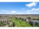 Beautiful aerial view of condos neighboring a golf course in a scenic community at 13850 E Marina Dr # 304, Aurora, CO 80014