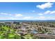 Community aerial view showcasing golf course, neighborhood, tennis courts and a pool at 13850 E Marina Dr # 304, Aurora, CO 80014