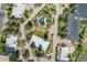 Aerial view of the community featuring a tennis court, pond, and building exteriors at 13850 E Marina Dr # 304, Aurora, CO 80014