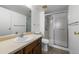 Bathroom featuring a shower with sliding door, a sink with vanity, and modern fixtures at 13850 E Marina Dr # 304, Aurora, CO 80014