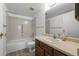 Bathroom featuring a tub and shower, neutral-toned walls, and a vanity with a sink and mirror at 13850 E Marina Dr # 304, Aurora, CO 80014