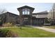 Inviting clubhouse with stone accents, large windows, and well-maintained landscaping at 13850 E Marina Dr # 304, Aurora, CO 80014