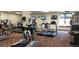 Well-equipped fitness center featuring modern treadmills, weights, and mounted televisions at 13850 E Marina Dr # 304, Aurora, CO 80014