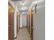 Well-lit hallway featuring multiple doors and neutral color scheme at 13850 E Marina Dr # 304, Aurora, CO 80014