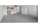 Spacious living room with an open floor plan and neutral carpeting leads to a well-lit kitchen at 13850 E Marina Dr # 304, Aurora, CO 80014