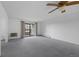 Bright living room featuring sliding doors, carpet flooring, and neutral walls at 13850 E Marina Dr # 304, Aurora, CO 80014