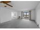Inviting living room showcasing carpet flooring, natural lighting, and a neutral color palette at 13850 E Marina Dr # 304, Aurora, CO 80014