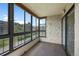 Large windows bring natural light into this bright and cozy carpeted sunroom at 13850 E Marina Dr # 304, Aurora, CO 80014
