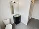 Compact bathroom with a sink and vanity at 8536 S Upham Way, Littleton, CO 80128