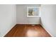 Bedroom with hardwood floors and a bright window at 8536 S Upham Way, Littleton, CO 80128