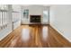A living room featuring hardwood floors, a fireplace, and natural light at 8536 S Upham Way, Littleton, CO 80128