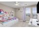 Bright bedroom with a built-in bookshelf headboard, plush carpet and natural light at 6731 Pinery Villa Pl, Parker, CO 80134