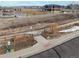 Community path with wooden fence, gate, and a path. Close to building at 6731 Pinery Villa Pl, Parker, CO 80134