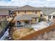 Aerial view of home's backyard featuring a covered patio with outdoor seating and a fenced yard at 6731 Pinery Villa Pl, Parker, CO 80134