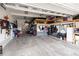 Organized garage space with storage shelves, equipment, and tools neatly arranged at 6731 Pinery Villa Pl, Parker, CO 80134