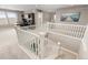 Versatile loft area with a built-in desk, bright windows, and a view of the staircase below at 6731 Pinery Villa Pl, Parker, CO 80134