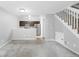 Open living space showcases neutral walls, carpet, stairs to the upper level and an open concept kitchen at 14343 E Dickinson Dr # E, Aurora, CO 80014