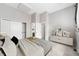 Cozy bedroom featuring neutral walls, carpet, closet, and ensuite bathroom with modern fixtures and ample storage at 14343 E Dickinson Dr # E, Aurora, CO 80014