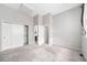 Bright and airy bedroom with carpet, ensuite bathroom, closet, and neutral tones creating a serene atmosphere at 14343 E Dickinson Dr # E, Aurora, CO 80014