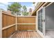 Private patio with wood decking and sliding glass doors, perfect for relaxing or entertaining outdoors at 14343 E Dickinson Dr # E, Aurora, CO 80014