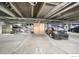 Parking garage with cement floors and ceiling, plus parked cars and bicycles at 3100 Huron St # 3P, Denver, CO 80202