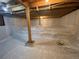 Clean basement with newly encapsulated walls to prevent water damage, beams and new support posts at 324 County Road 672, Breckenridge, CO 80424