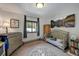 Charming Bedroom with a dresser changing table, crib, and mountain artwork at 324 County Road 672, Breckenridge, CO 80424