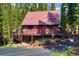 Exterior of a cozy cabin featuring a charming deck and beautifully landscaped yard at 324 County Road 672, Breckenridge, CO 80424