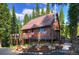 Charming cabin exterior featuring a welcoming deck and beautiful surroundings at 324 County Road 672, Breckenridge, CO 80424