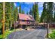 Exterior of cozy cabin featuring a large driveway and beautiful surroundings at 324 County Road 672, Breckenridge, CO 80424
