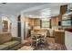 Open kitchen featuring stainless steel appliances, wood cabinets, and connection to living room at 324 County Road 672, Breckenridge, CO 80424