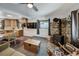 Open-concept living room featuring a wood stove, wooden storage chest, and adjacent dining area at 324 County Road 672, Breckenridge, CO 80424